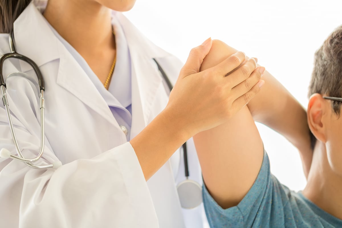 close-up-physiotherapist-working-with-patient-clinic